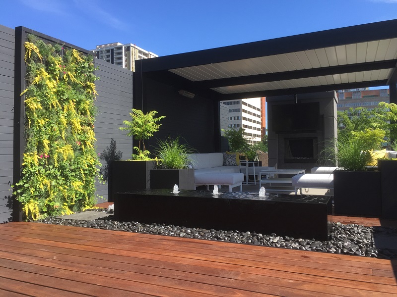 A rooftop patio architectural water feature is a highlight to this contemporary rooftop project.