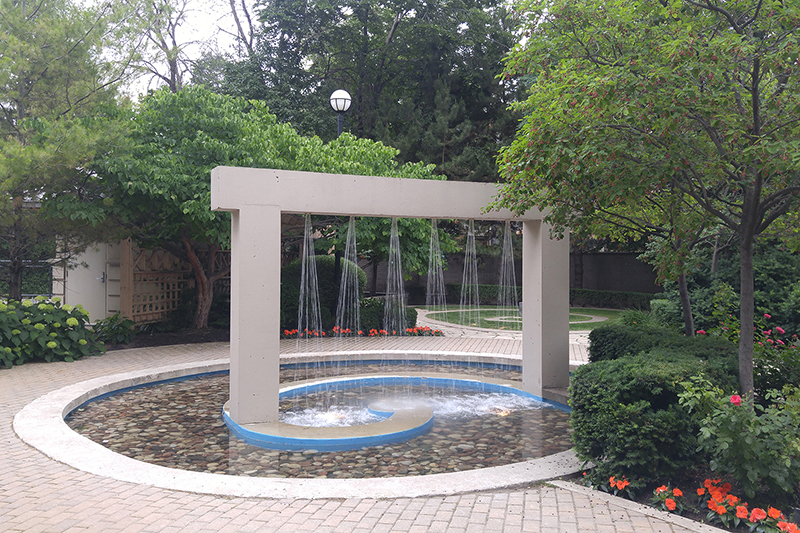 Fountain with six even spray patterns after its nozzles were cleaned and cleared