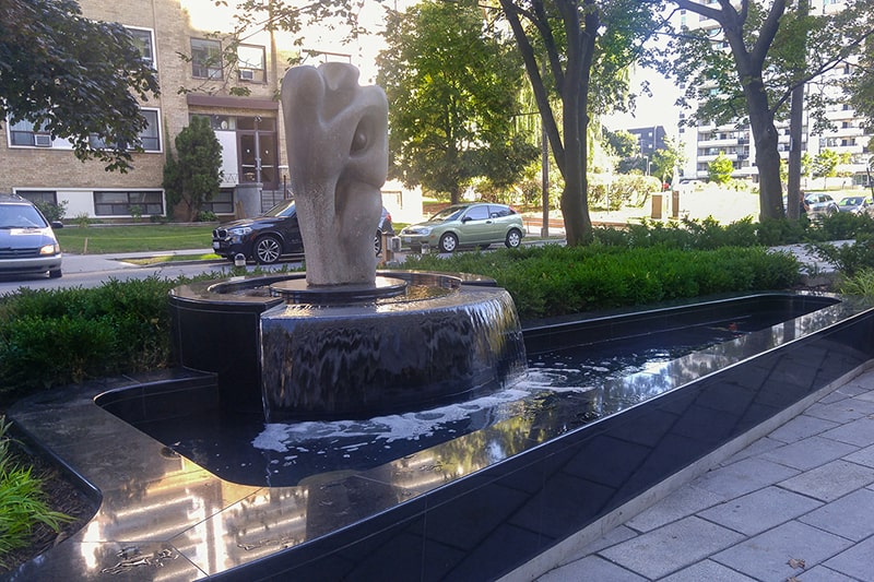 Water feature designed around a historic artist’s sculpture in Toronto