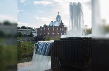 With city hall and the clocktower in the background this water fountain highlights the town and brings back a piece of the Townships heritage.