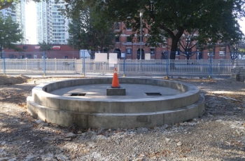 A concrete basin and pool has been poured to contain and locate the fountain being removed from the Art Gallery of Ontario. The fountain has been dismantled and ready for installation at its new location in Clarence Square in Toronto.