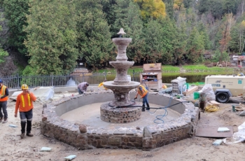 This images shows the stone specialists from Clifford Restoration restoring the stone and bringing the Belfountain back to life after many years of neglect.