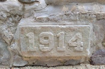 This image shows the hand carved 1914 datestone for the Belfountain fountain located in Ontario Canada.