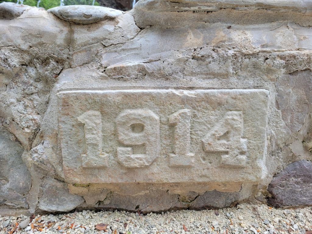 Carved 1914 datestone on the original stonework of the Belfountain