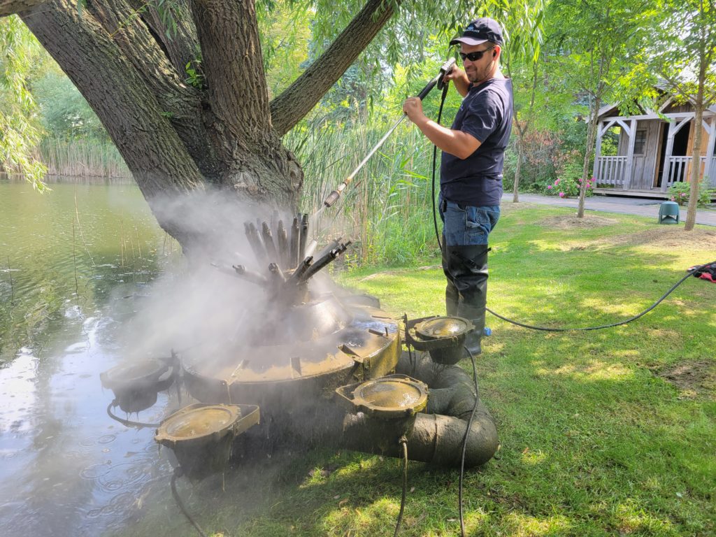 Scott Bishop servicing a floating fountain