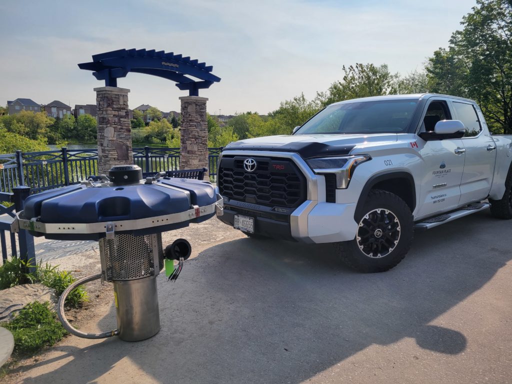 Aqua Master floating fountain aerating a pond in York Region