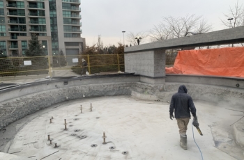 Concrete is then installed around the fittings closing the garage slab. Hot applied waterproofing will then be installed on the concrete and a clamping system will be used to ensure a tight seal on the pennetrations.