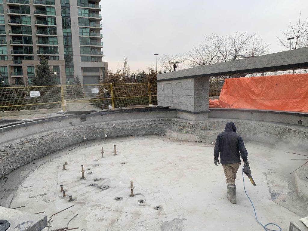 Concrete placed around the fittings to close the garage slab, ready for hot-applied waterproofing and clamps