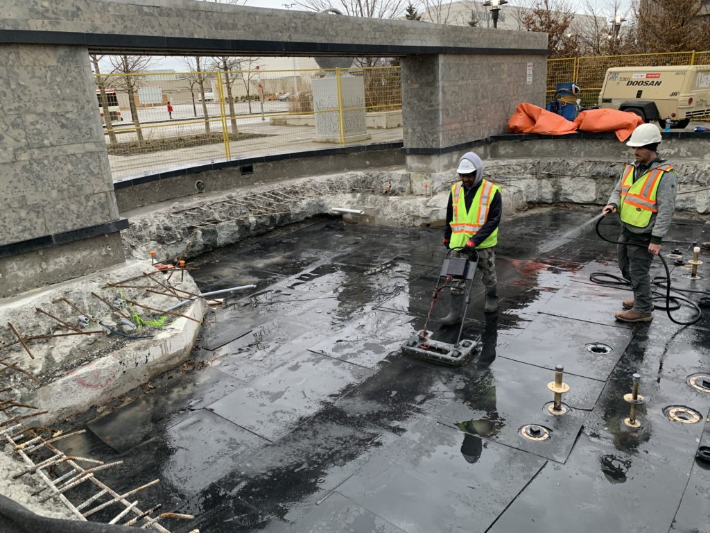 Protection board installed over the waterproofing after electronic testing confirmed a tight seal
