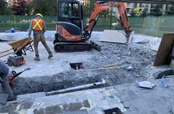 The entire fountain needed to be removed and the concrete was almost thirty inches deep so a small excavator with a demolition hammer was brought in for the job
