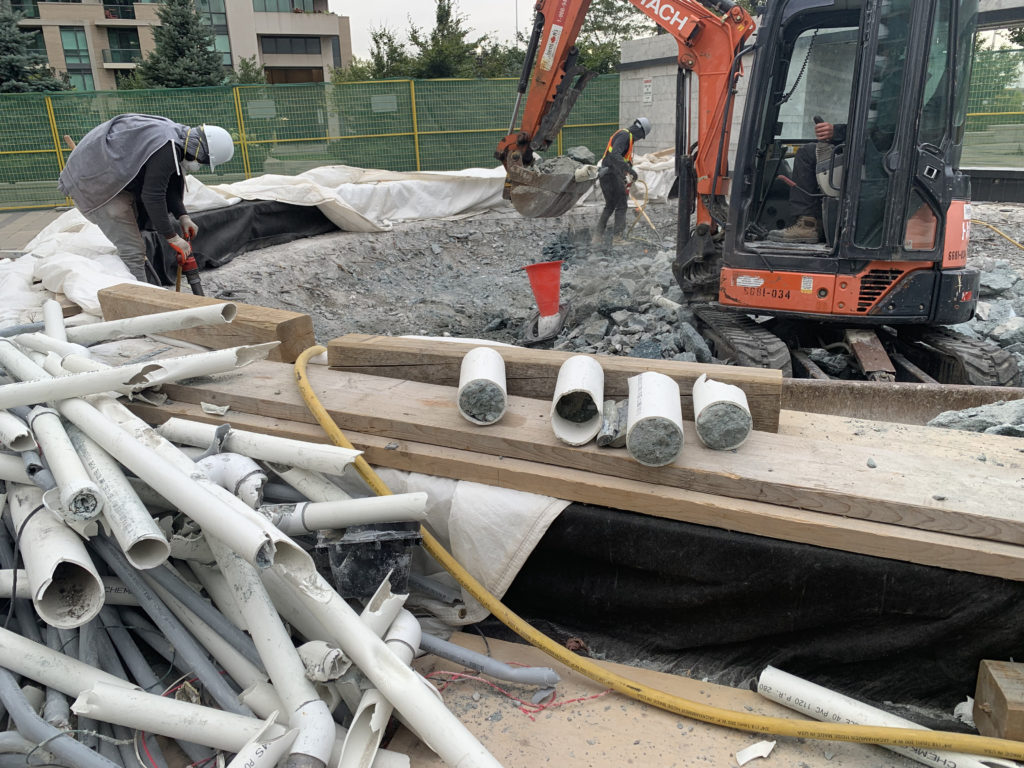 Broken pipes filled with concrete by the original installers, trapped so winter water could not drain